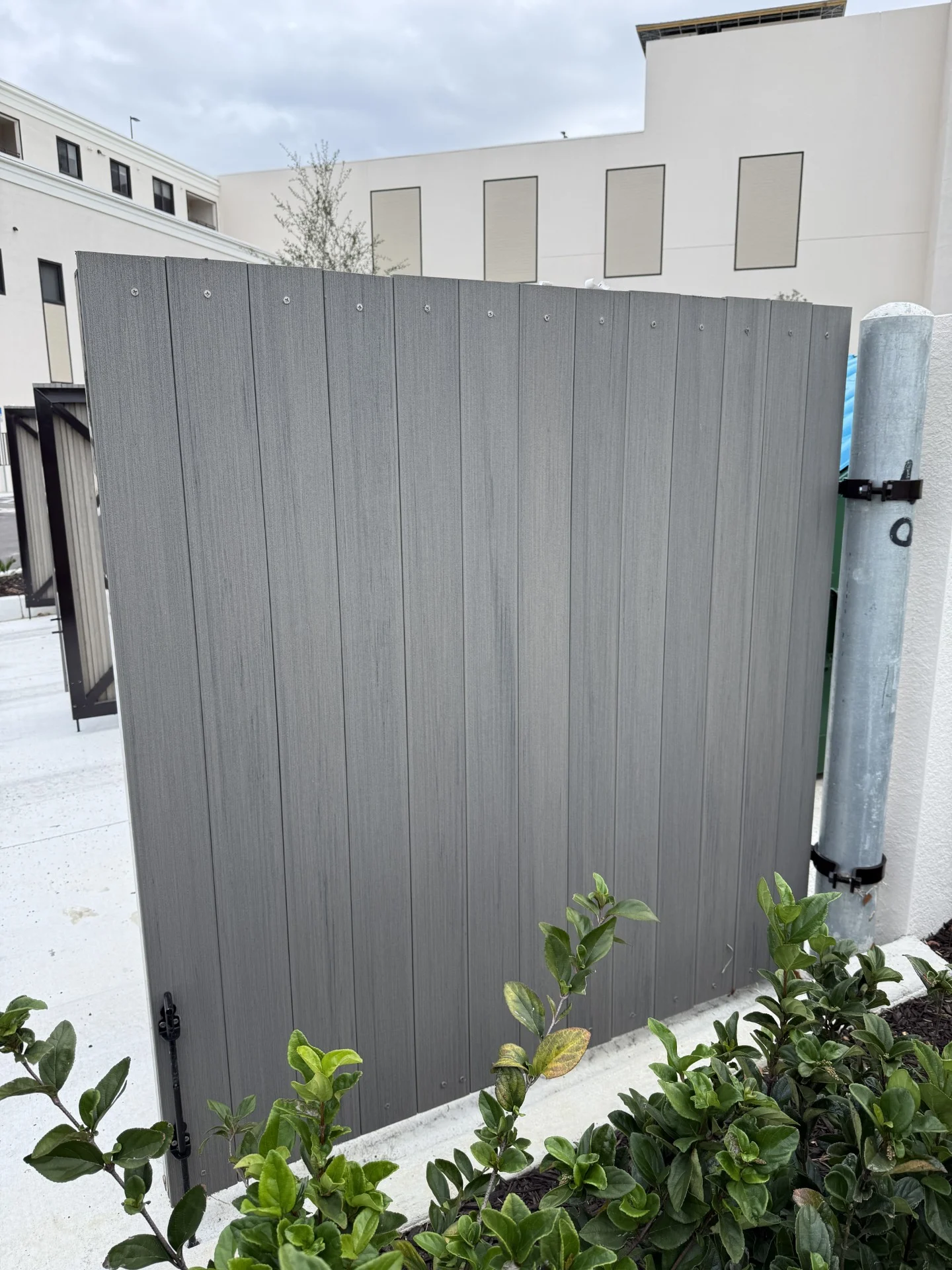 Brooks & Freund – Bimini Square – Dumpster Gate (2) Louvered aluminum dumpster enclosure gate at Bimini Square