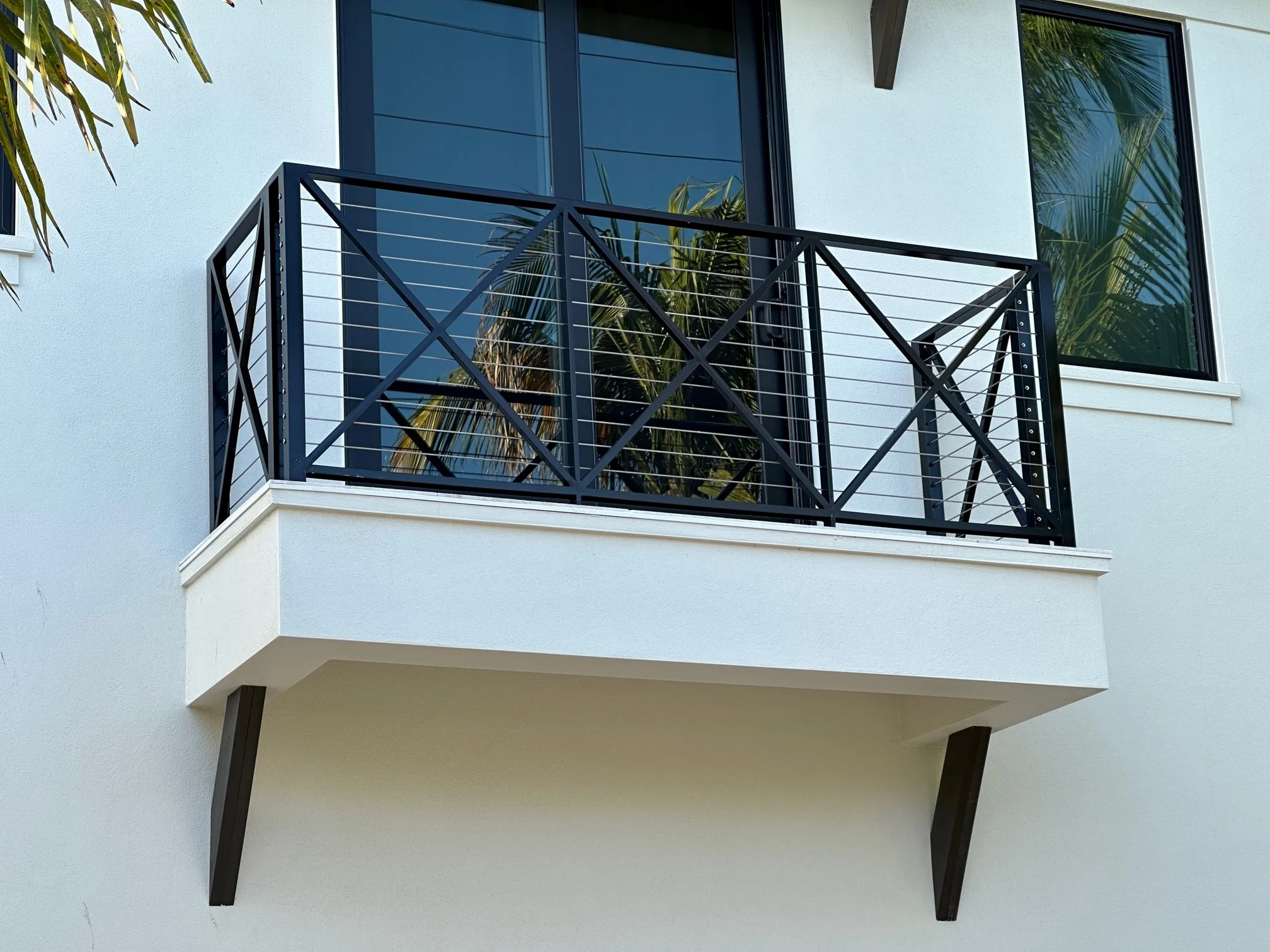 Stainless steel cable railing set in aluminum posts