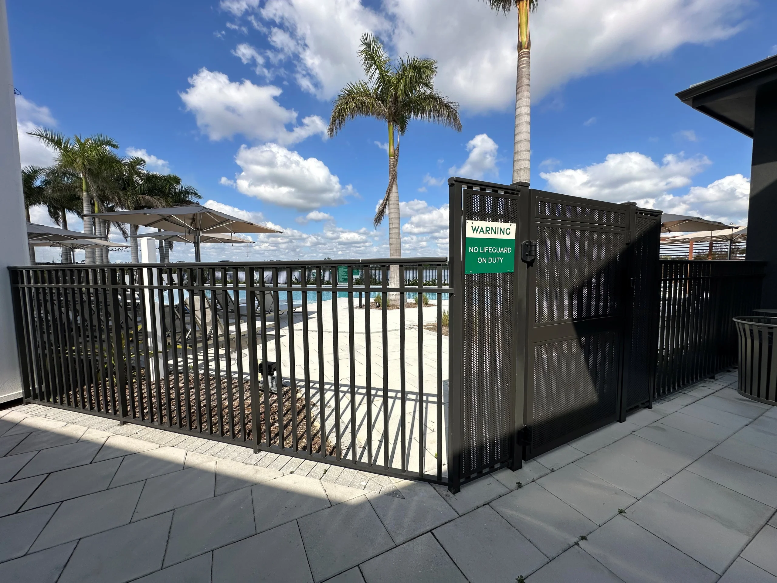 Canopy at Babcock – Pool Fence – Three Line – Mechanical Fence – Pool Gate – Panic Hardware Aluminum pool gate with safety hardware at Babcock