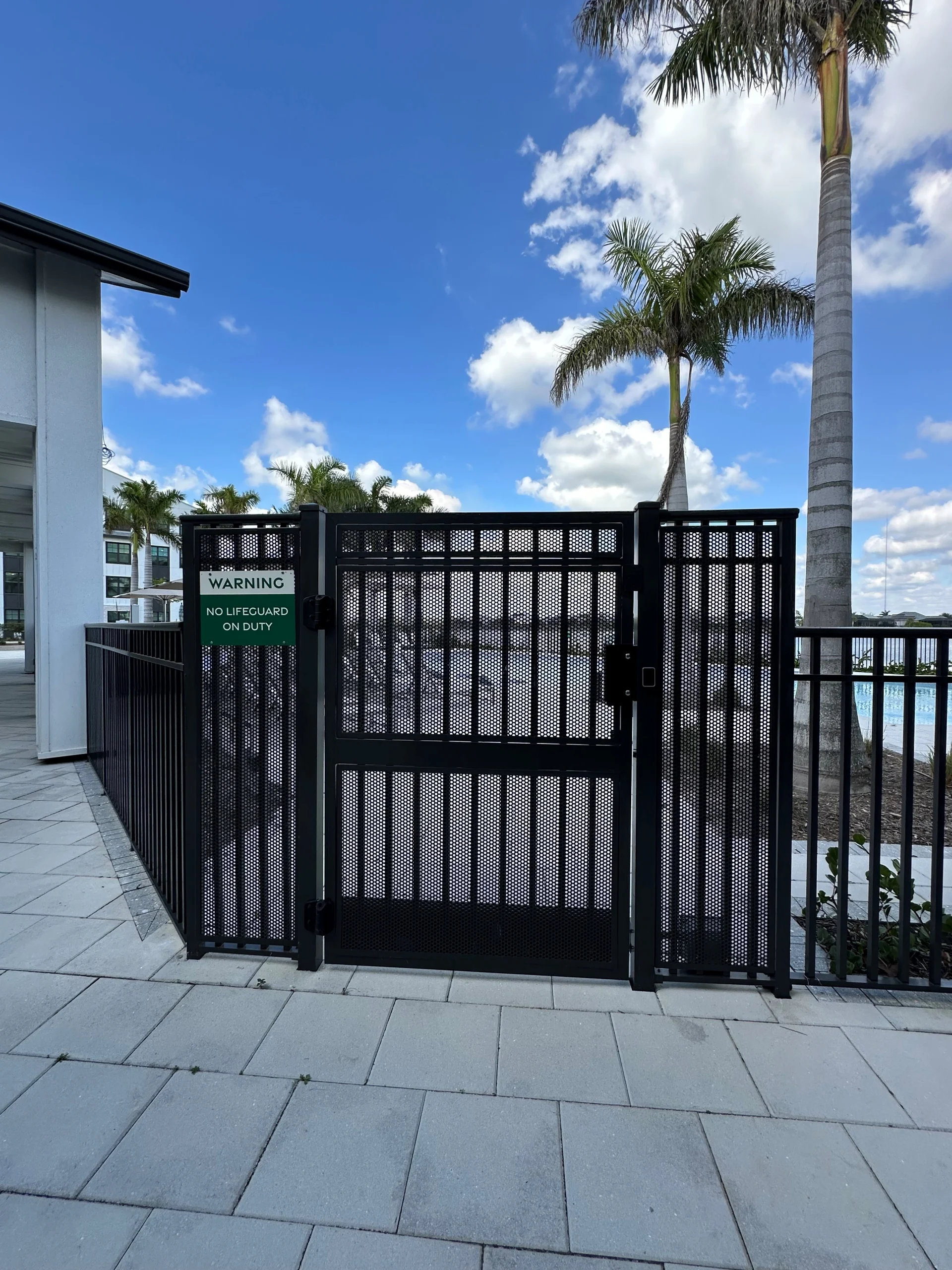 Deangelis Diamond – Canopy at Babcock – Welded Pool Gate with Mesh Panels Aluminum pool gate with safety hardware at Babcock