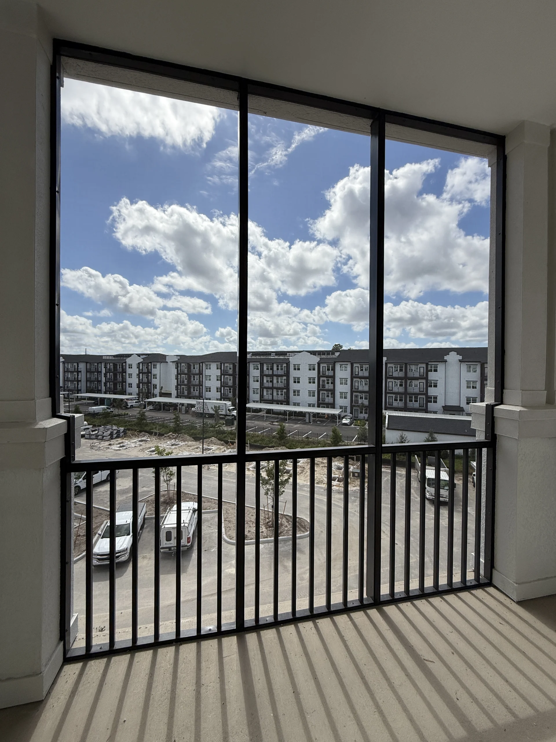 Kaufman Lynn – Fiori – Condo Screen (4) Aluminum condo screen wall on a balcony at Fiori