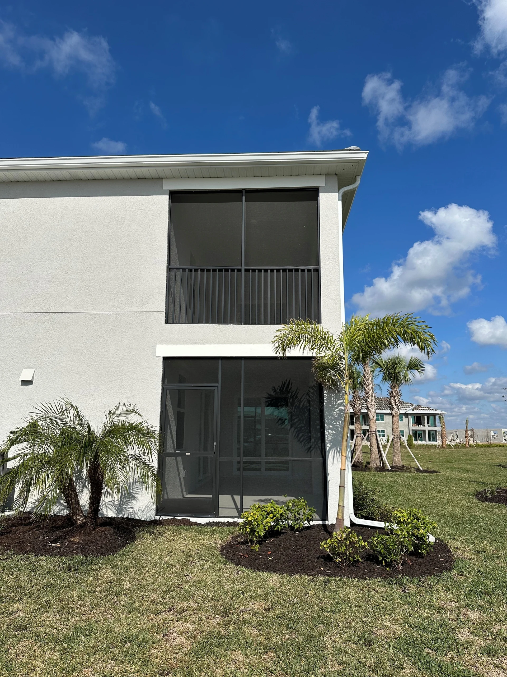 Lennar – Willowgreen – Condo Screen Walls (1) Aluminum condo screen wall on a balcony at Willowgreen