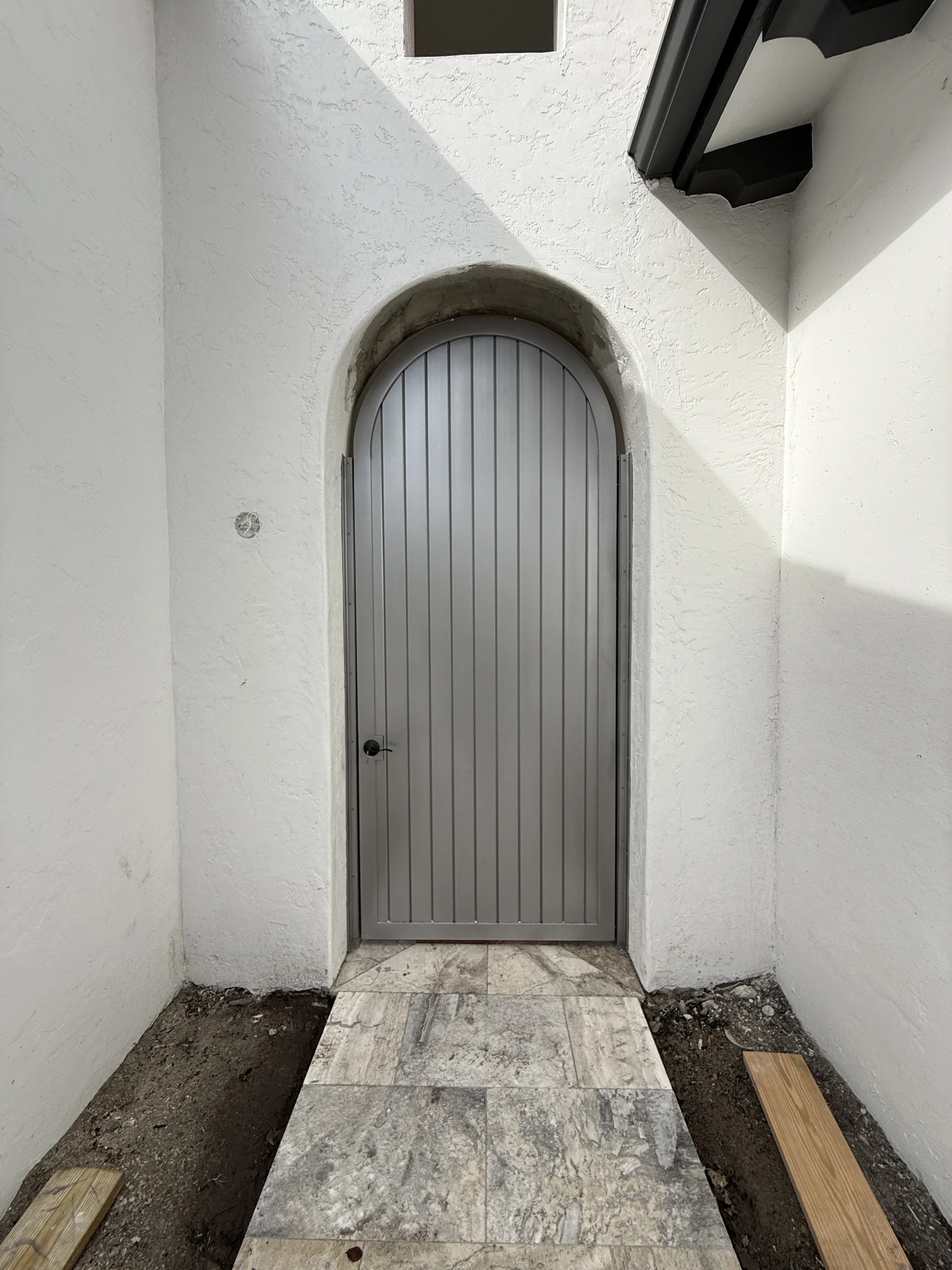 Paterra Custom Homes – Entry Gate – Arched Gate (2) Custom arched aluminum entry gate fabricated for Paterra Custom Homes
